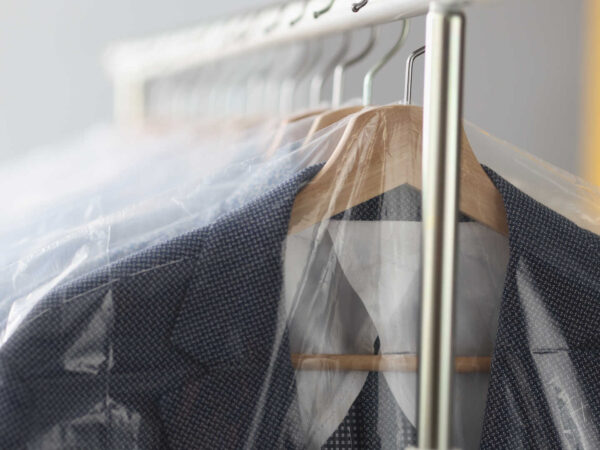 How to wash a suit jacket – Clean suit jackets hung up in Laundromat