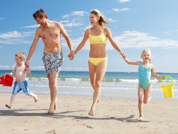 How to wash swimwear – Family having fun on the beach