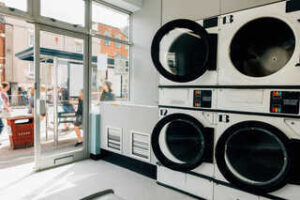 Self service laundromat with outlook of busy street