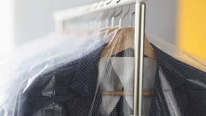 How to wash a suit jacket – Clean suit jackets hung up in Laundromat