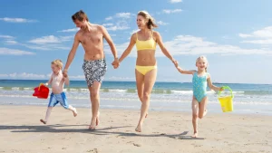 How to wash swimwear – Family having fun on the beach