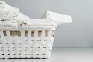 white basket with fresh clean clothes